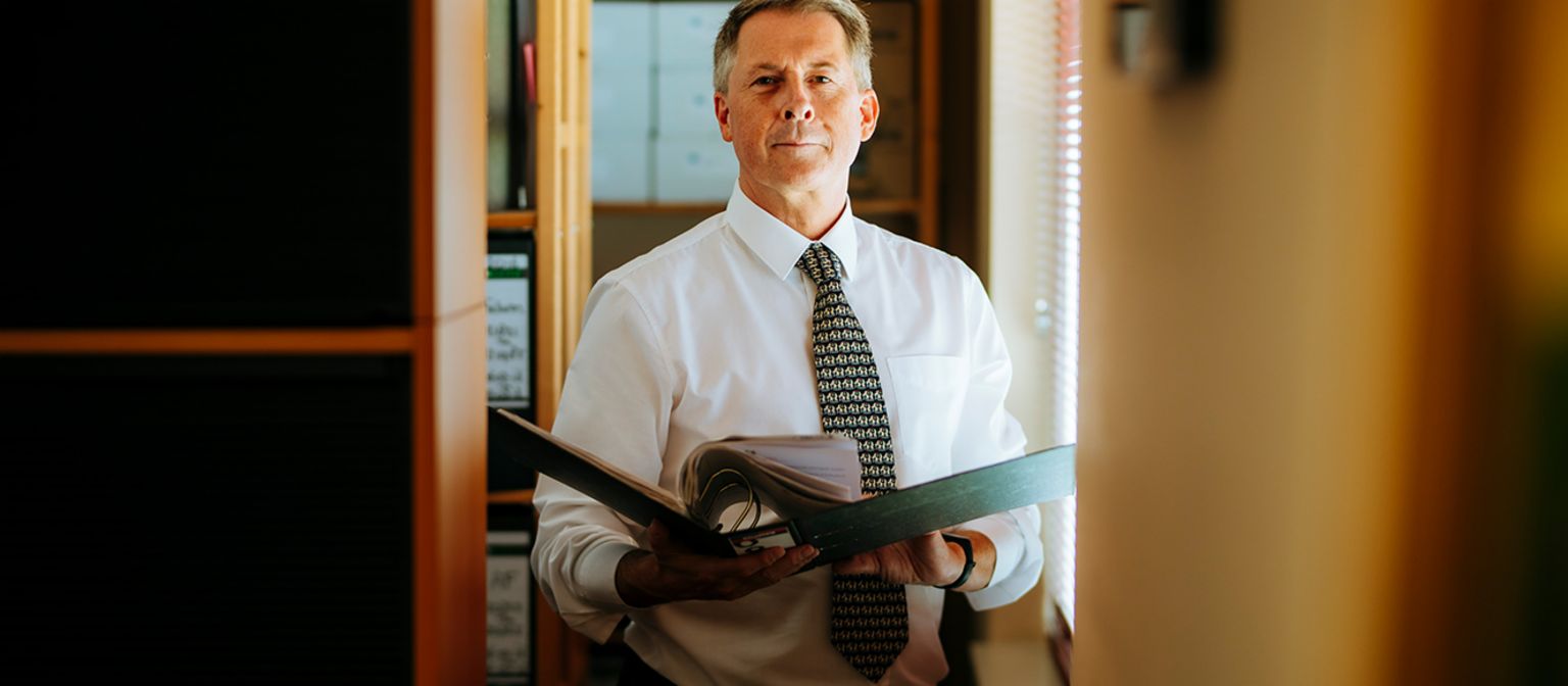International debt collection: Raymond Pappot looks through files in the archive.