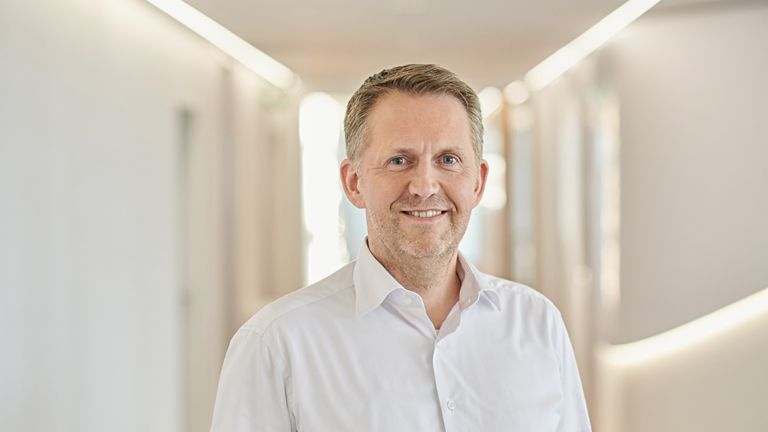 Andreas Kropp, member of the EOS Group’s Board of Directors responsible for Germany<br/>is smiling. 