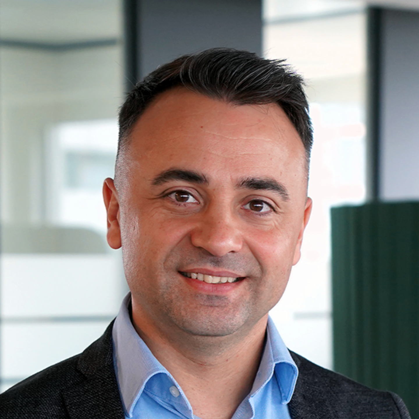 The image shows a portrait of the conversation partner Paul Baltag, Digital Transformation Manager at EOS Romania.